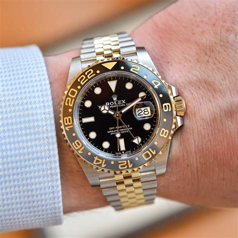 rolex gmt-master ii black dial yellow gold steel oysterlock|rolex gmt master 2 models.